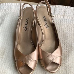 Women’s gold wedged sandals with adjustable strap